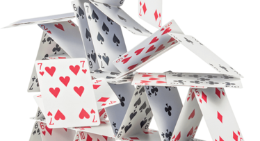 Main image showing a collapsing house of cards